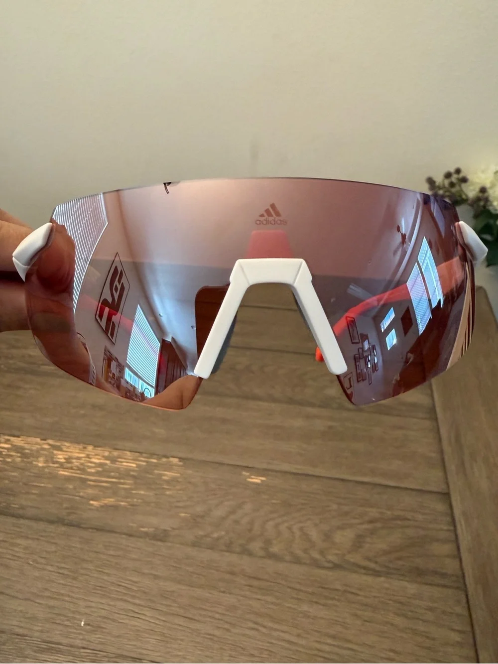 Adidas Sport SP0077 rimless shield sunglasses feature a white/red frames